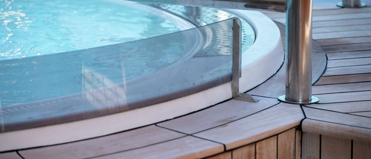 Relax in two hot tubs on deck 7