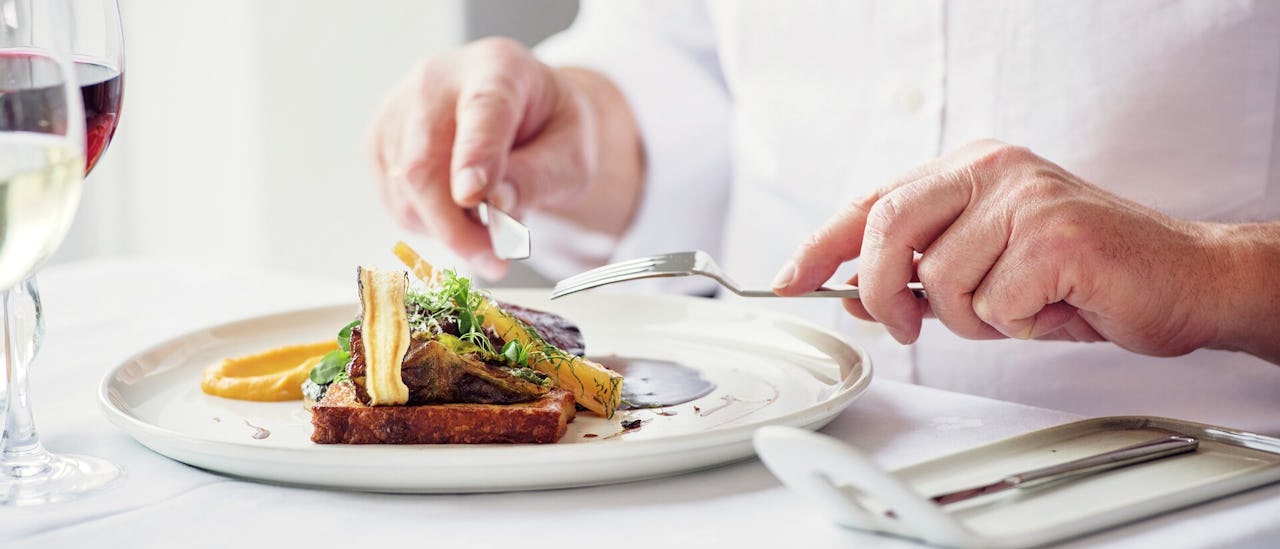 Indulge in a luxurious dinner at "Kusten," the ship's à la carte restaurant